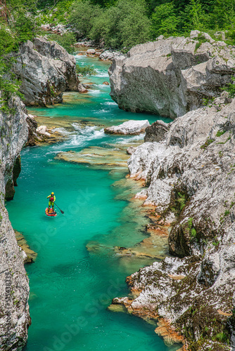 Paddleboarding in the The Great Soča Gorge, Beautiful gorge with emerald coloured water flowing between the uniquely formed rocks, Triglav National Park, Julian Alps, Slovenia, Europe