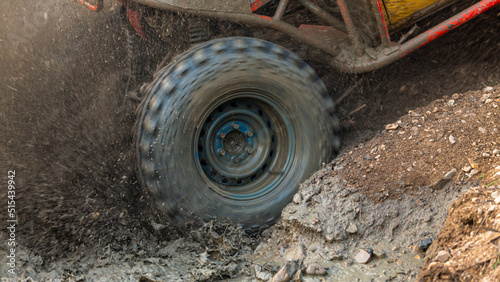 Motion the wheels tires off road water and mud splash, 4x4 or 4WD car with wheels in mud off road, Car stuck in puddle of mud, Wheel covered with dirt.