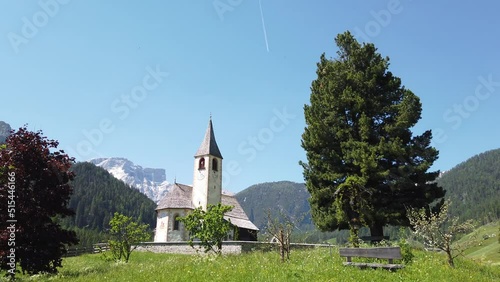 St. Vitus church in South-Tirol, Italy with Seekofel mountain in the background photo