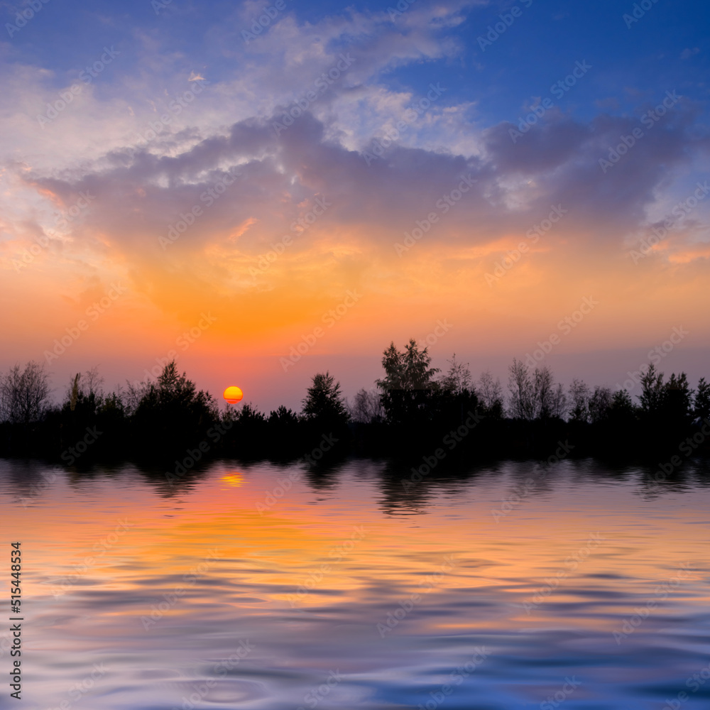 dramatic sunset over small lake, quiet natural sunset background