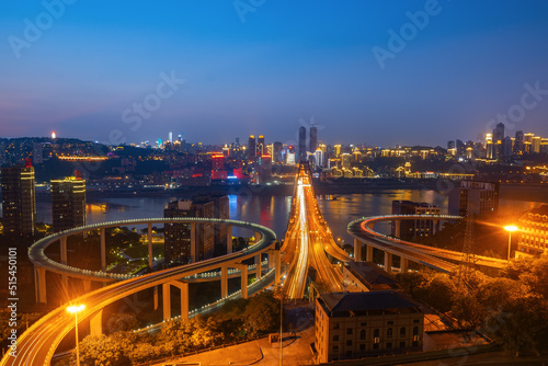 At night, the circular overpass and the urban skyline are in Chongqing, China
