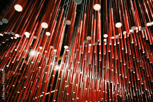 Red fluorescent tube lights hanging from the ceiling