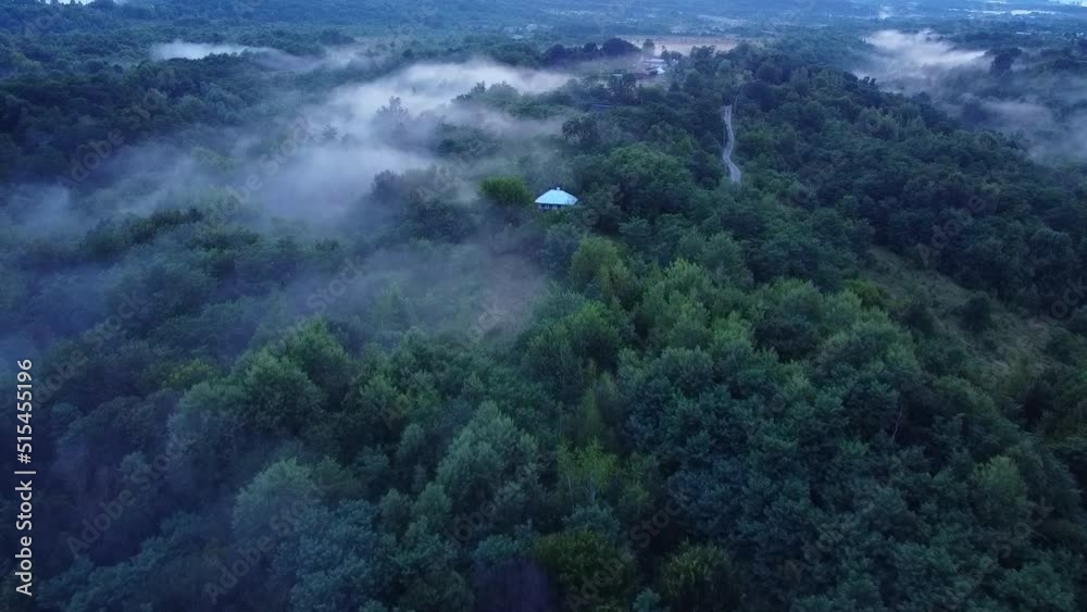Beautiful aerial landscape above a foggy forest Beautiful aerial landscape above a foggy forest