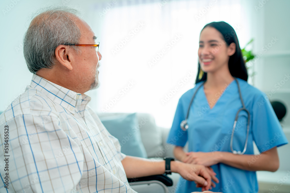 Asian nurse or doctor smile and take care of senior man and they also stay in living room with day light. Asian nurse or doctor smile and take care of senior man and they also stay in living room with day light.