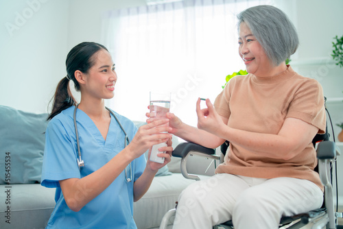 Nurse or doctor help to explain and give medicine to senior man during process of health support for home care.