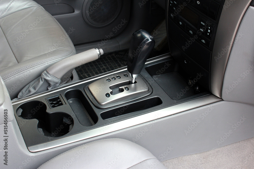 Automatic gearbox lever, black interior car. Automatic transmission gearshift stick, Closeup a manual shift of modern car gear shifter