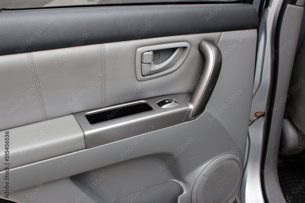 Car Inside Door Handle Interior. Door trim. Window lifters control. Side Window Switch. Beige Car Interior. 