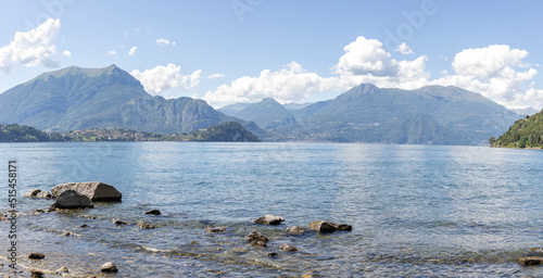 Como Lake. Panoramic view of Como Lake with mountains and clouds in background. Panoramic composition.