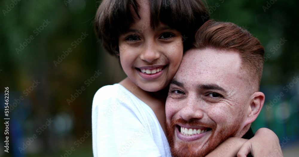 Parent and child hugging and embrace. Father and young boy ethnic diverse love and care, authentic Parent and child hugging and embrace. Father and young boy ethnic diverse love and care, authentic