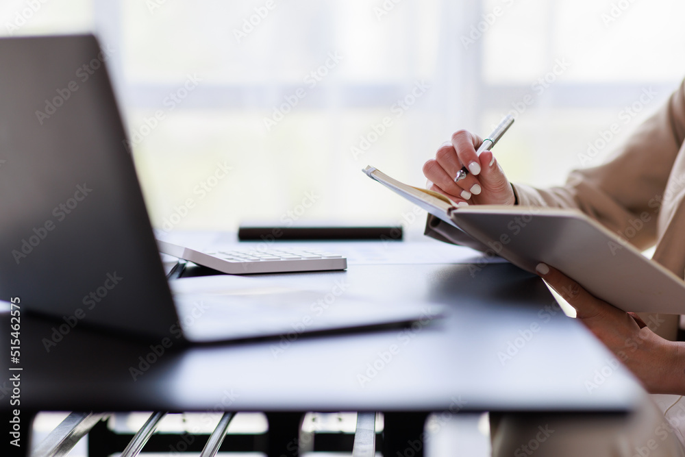 Close up Businesswoman hand typing on computer keyboard of a laptop computer in office. Business and finance concept. Close up Businesswoman hand typing on computer keyboard of a laptop computer in office. Business and finance concept.