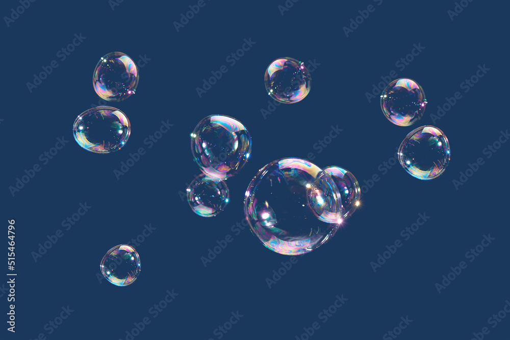 Flying soap bubbles isolated on blue background. Abstract background. Flying soap bubbles isolated on blue background. Abstract background.
