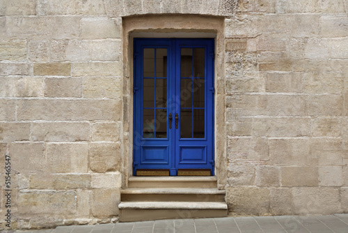 View of building with blue wooden door. Exterior design © New Africa