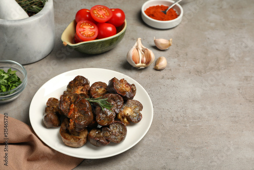 Wallpaper Mural Delicious kidneys with rosemary and ingredients on light table, space for text Torontodigital.ca