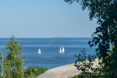 Sailboats on Curonian Lagoon, Nida, Lithuania. View from .The Dune of Parnidis. photo