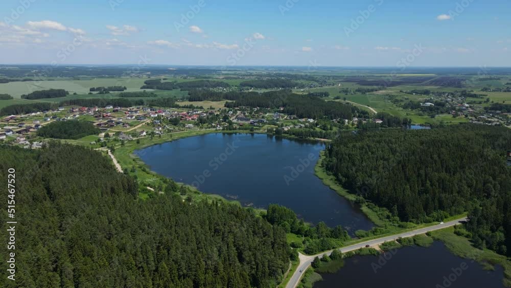 Top View. Two Small Lakes Separated by a Road. Dense forest Top View. Two Small Lakes Separated by a Road. Dense forest