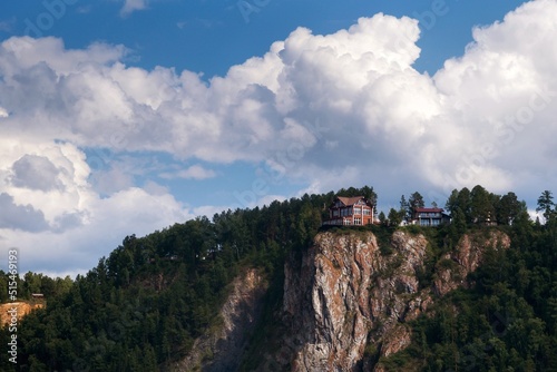 View of the red house on the top of the cliff.