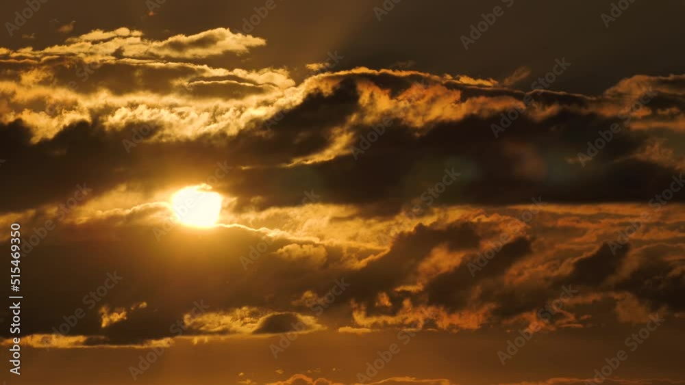 Golden sunset by the lake. Solar unity harmony with nature. Reflection of sunlight on the surface of the lake. Beautiful yellow evening shot. Setting sun by the lake. Blowing in a gentle summer breeze
