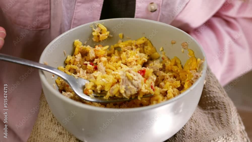 Eating a bowl of fried rice with fork Eating a bowl of fried rice with fork