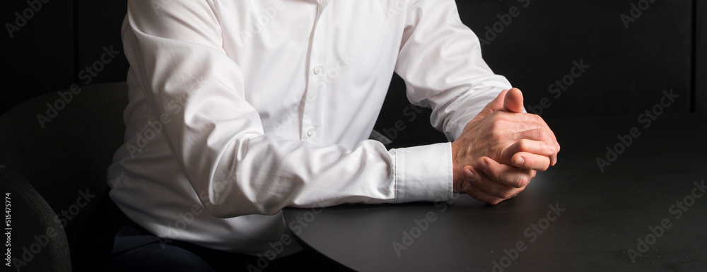 businessman in negotiations.hands of a businessman in a white shirt close-up during the negotiation of a meeting businessman in negotiations.hands of a businessman in a white shirt close-up during the negotiation of a meeting