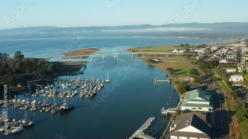 Aerial shot of cars, bridge, and boats in Eureka in coastal redwood forest photo