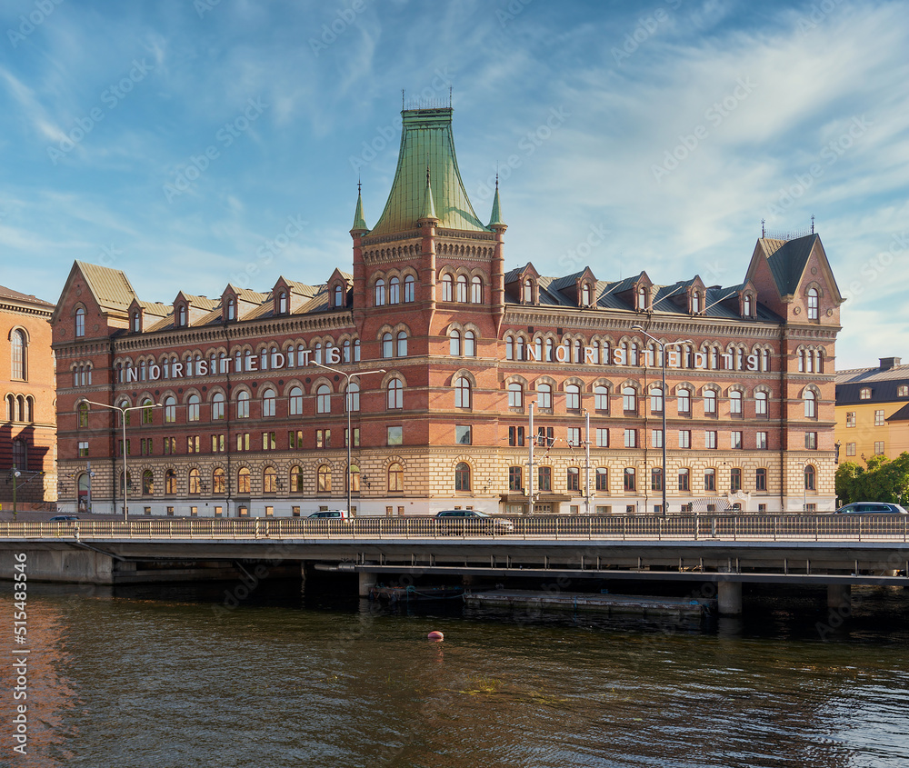 Norstedt Building, or Norstedtshuset, overlooking The Vasa Bridge, or Vasabron, located in central Stockholm, in a summer sunny day. The bridge connects Norrmalm to Gamla stan, Stockholm, Sweden