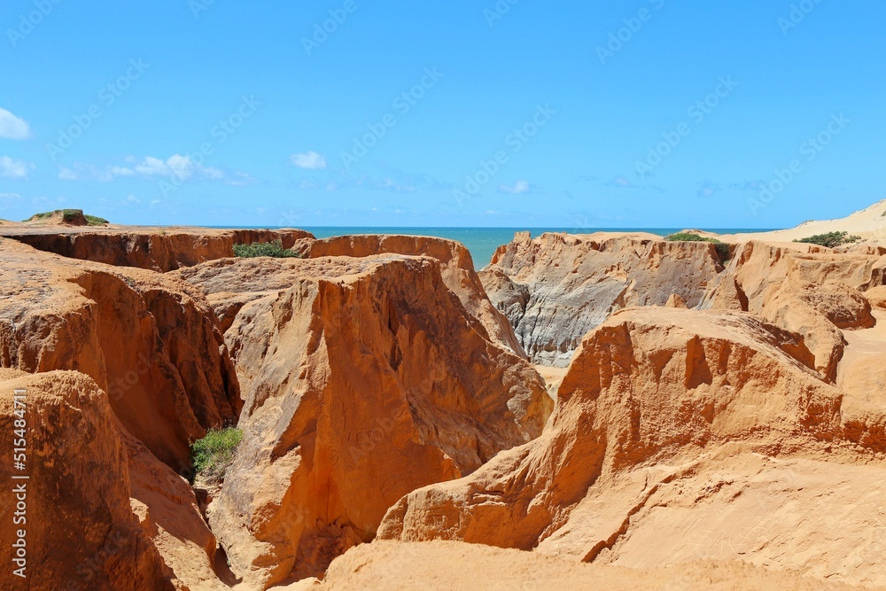 Red cliffs and canyons in Morro Branco in Ceará., Brazil. Beauty constructed by the rain and wind erosion, near to the seashore