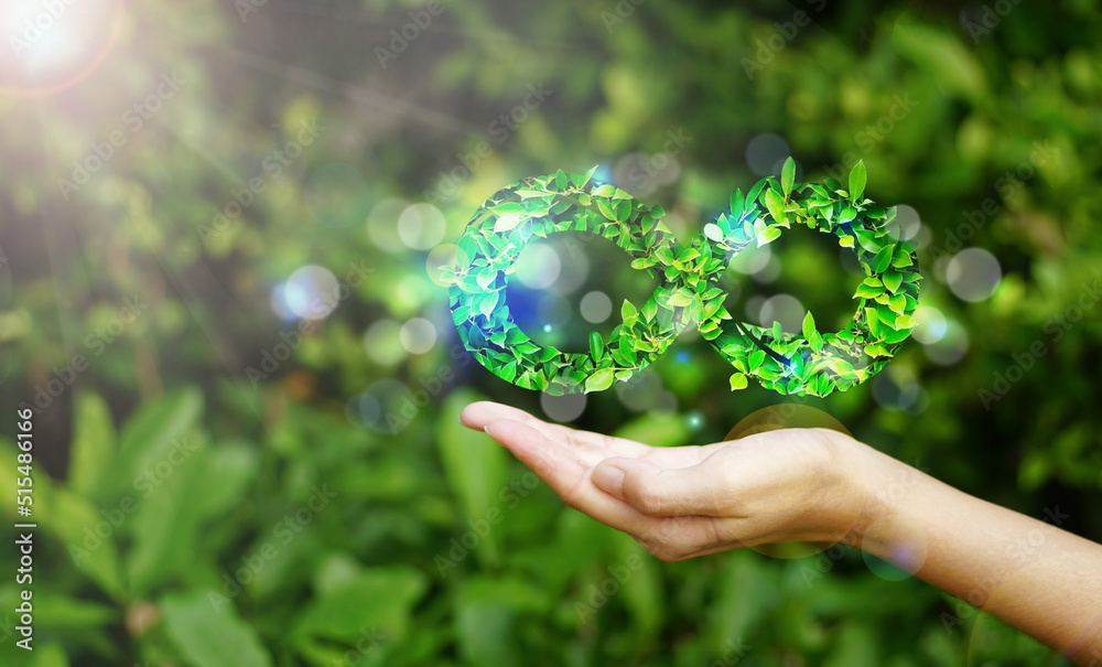 hand hold the circular economy icon. The concept of eternity, endless and unlimited on nature background, circular economy for future growth of business and environment sustainable hand hold the circular economy icon. The concept of eternity, endless and unlimited on nature background, circular economy for future growth of business and environment sustainable