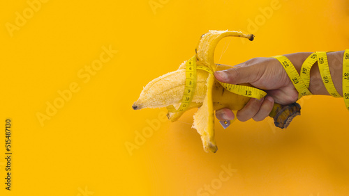 Hand holding a big banana