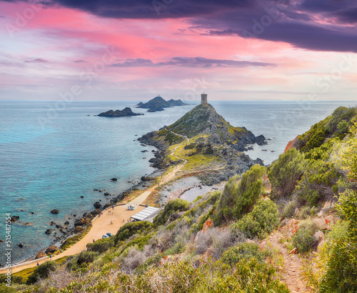 Sunset over popular tourist destination Torra di a Parata with Genoese Tower and Archipelago of Sanguinaires islands at background.