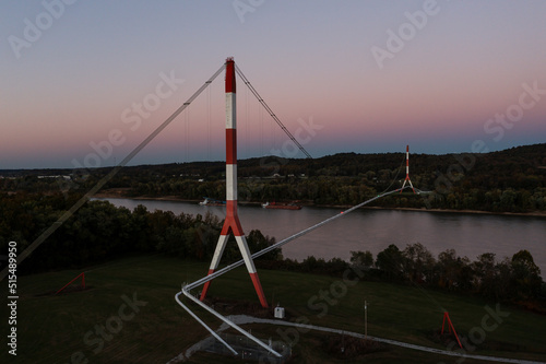 Fototapeta Naklejka Na Ścianę i Meble -  Aerial of Tennessee Gas Pipeline Bridge at Sunset - Wire Suspension - Still Waters of the Ohio River - Kentucky and Ohio