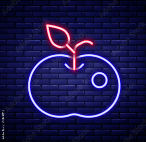 Glowing neon line Poison apple icon isolated on brick wall background. Poisoned witch apple. Colorful outline concept. Vector