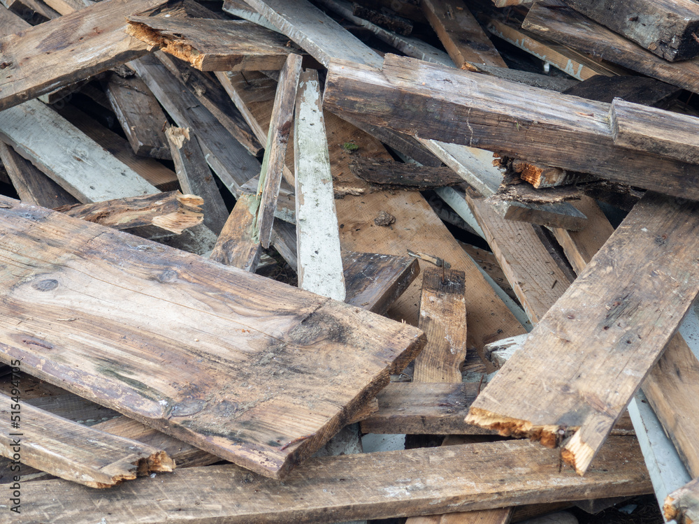 A pile of broken old boards. Lots of wood pieces. Old rotting sticks. Rubbish A pile of broken old boards. Lots of wood pieces. Old rotting sticks. Rubbish