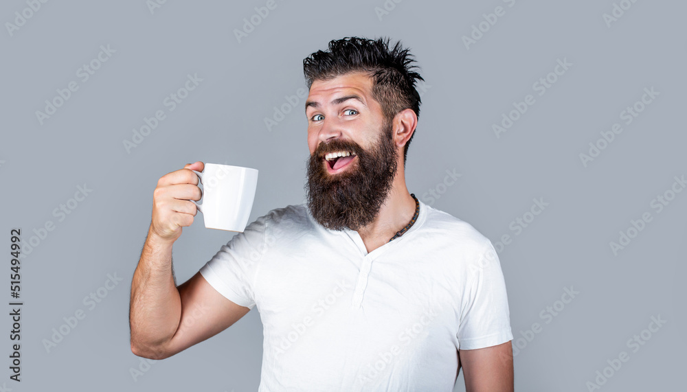 Bearded man smiling showing sign ok. Good morning, man tea, ok. Smiling hipster man with cup of fresh coffee, Happy man. Morning concept Bearded man smiling showing sign ok. Good morning, man tea, ok. Smiling hipster man with cup of fresh coffee, Happy man. Morning concept