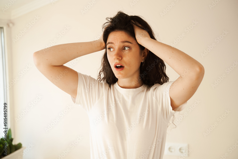 Migraine is a strong headache of woman. Overstressed woman touches her head because of pain. Depression of attractive girl. Migraine is a strong headache of woman. Overstressed woman touches her head because of pain. Depression of attractive girl.