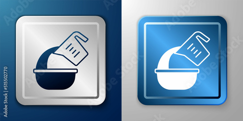White Measuring cup pouring liquid into bowl icon isolated on blue and grey background. Plastic graduated beaker with handle. Silver and blue square button. Vector
