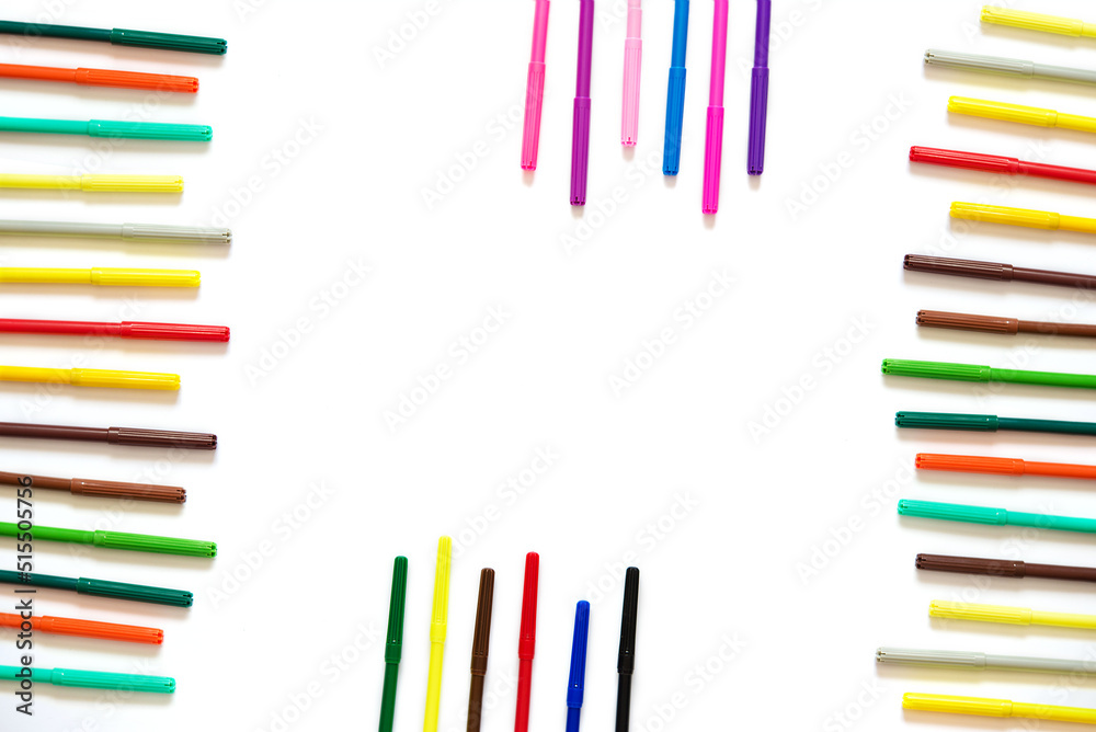 Multicolored felt-tip pens on an isolated white background. Back to school. Multicolored felt-tip pens on an isolated white background. Back to school.