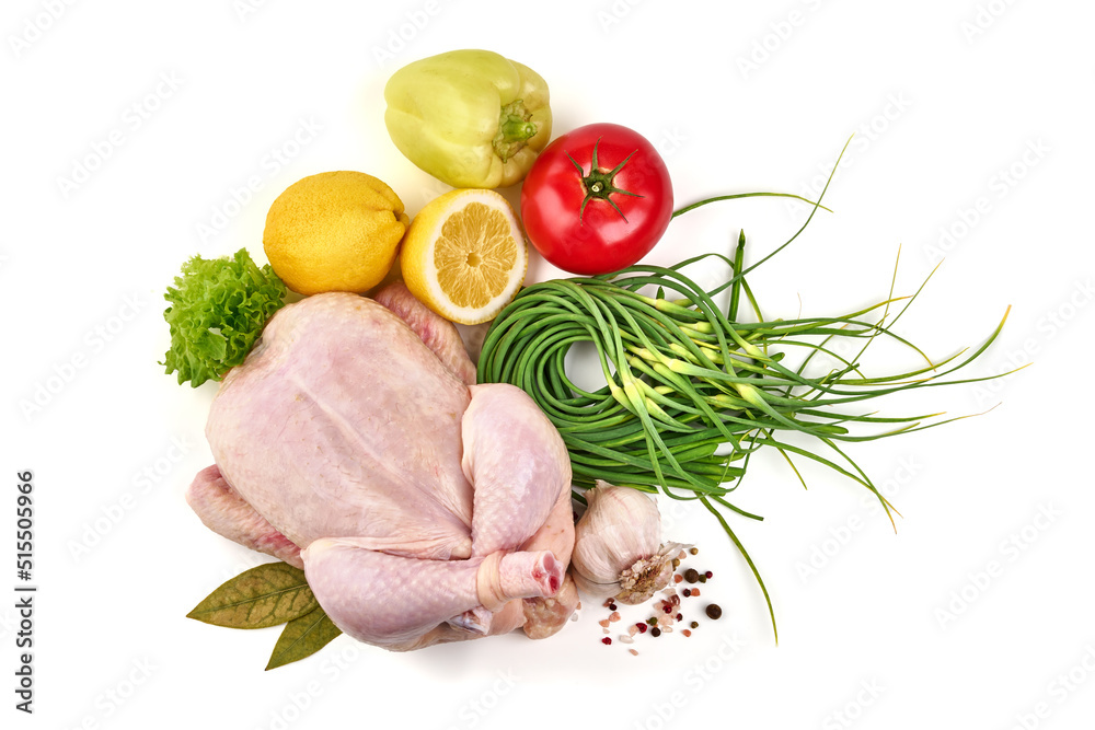 Raw whole chicken with spices and vegetables, isolated on white background. Raw whole chicken with spices and vegetables, isolated on white background.