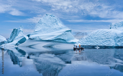 Zodiac travels past a massive Ice Flow in Scoresby Sound Greenland photo