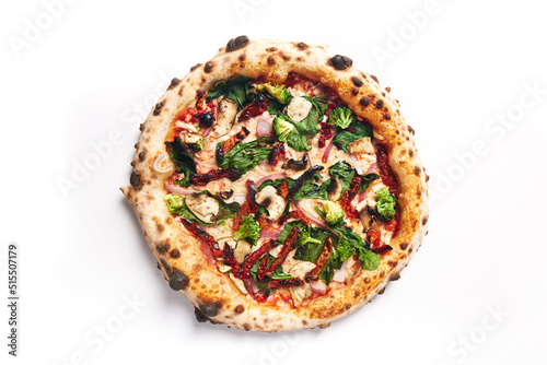 Top view of pizza topped with sun dried tomatos, mushrooms, red onion and braccoli on a white background