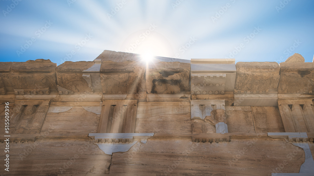 An ancient greek stone pattern forms a wall on the lower half of the ...