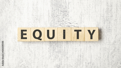 equity word background on wood blocks and white background © Andrey