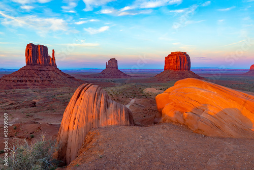 sunrise at west mitten butte in monument valley