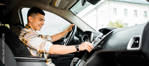Man driving a car view from the passenger seat