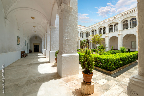 The picturesque inner courtyard of the cloisters of the Convent de Sant Agustí and and Església dels Socors in the historic center of the Old Town. photo