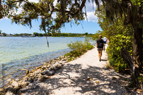Woman Hiking Beside Tampa Bay at De Soto National Memorial, Bradenton, Florida,  USA photo