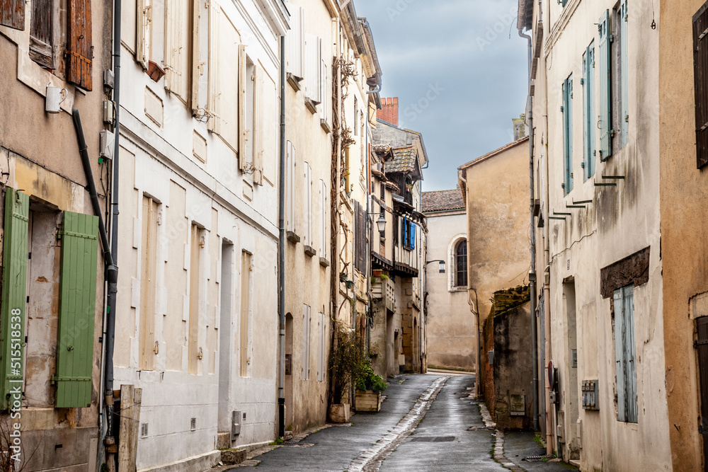 Face of medieval houses in a narrow street of a typical french medieval village and city, bergerac, in France, in the region of Dordogne and Perigord, with a typical  Southwestern French architecture