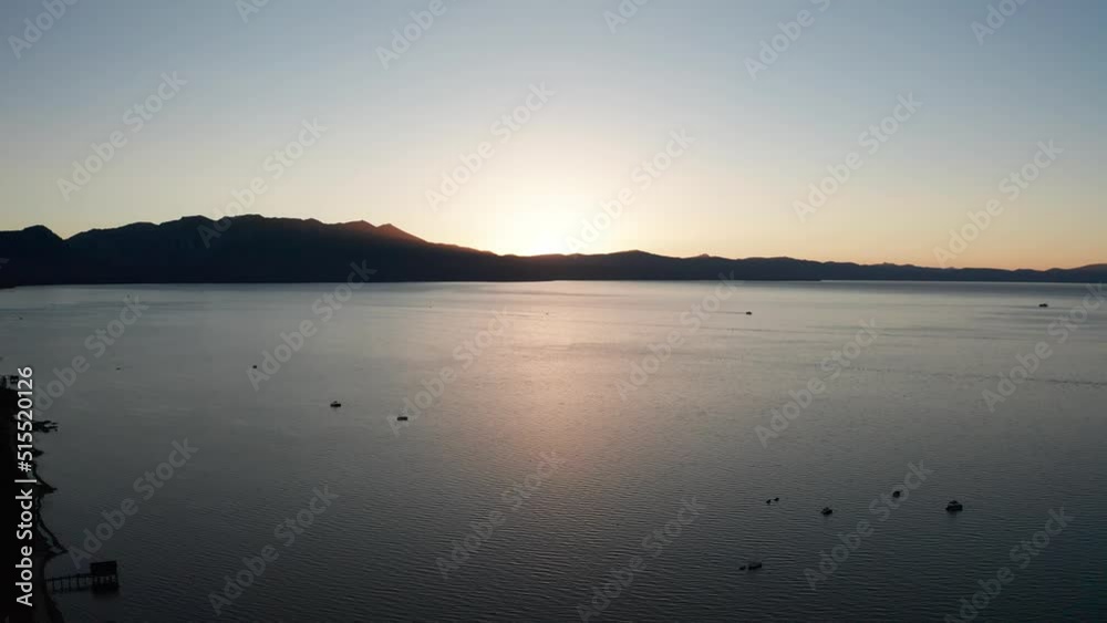 Reverse pullback aerial shot of Lake Tahoe at sunset in the summer. 4K Reverse pullback aerial shot of Lake Tahoe at sunset in the summer. 4K