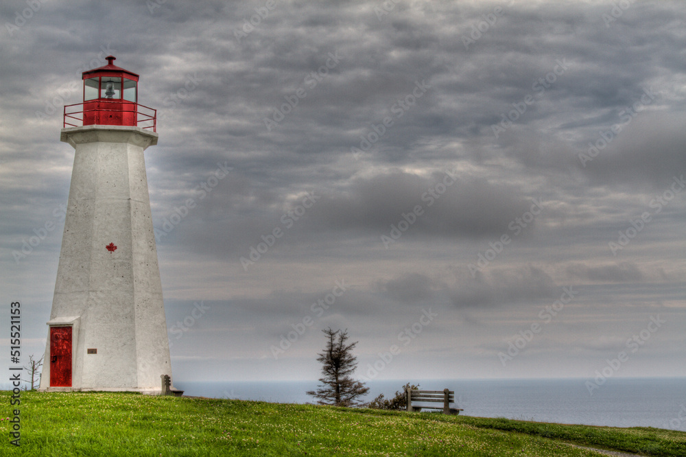 tall lighthouse with dramatic clouds