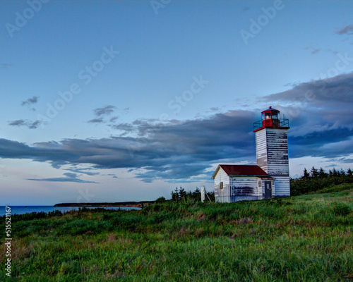 lighthouse at dusk with clouds