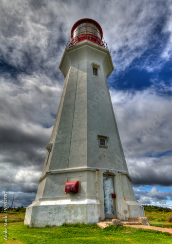 tall lighthouse with cloudy background